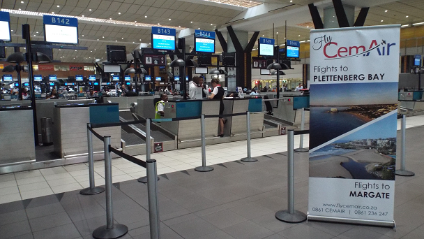 flycemair check in desk at or tambo international airport